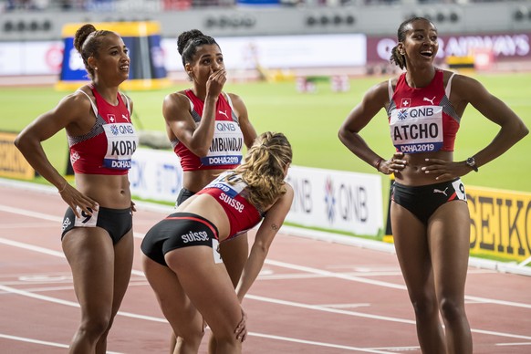 From left to right, Salome Kora, Mujinga Kambundji, Ajla Del Ponte, Sarah Atcho from Switzerland react during the women's 4x100 meters relay final at the IAAF World Athletics Championships, at the Kha ...