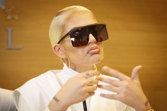 epa07560684 Albanian-Swiss rapper Loredana Zefi speaks to media during a press conference in Pristina, Kosovo, 10 May 2019. Zefi is accused to have cheated a Swiss couple by 700,000 Swiss francs (615, ...