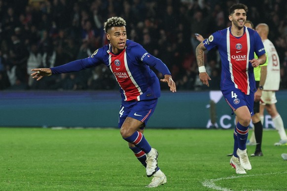 epa12946507 Desire Doue (L) of PSG celebrates with his teammates after scoring the first lead goal during the French Ligue 1 soccer match between PSG and Stade Brest, in Paris, France, 10 May 2026. EP ...