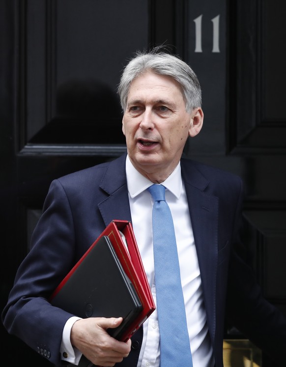 Britain&#039;s Chancellor of the Exchequer Philip Hammond leaves 10 Downing Street for the House of Commons to attend Prime Minister&#039;s question time, in London, Wednesday, Jan. 9, 2019. The Briti ...