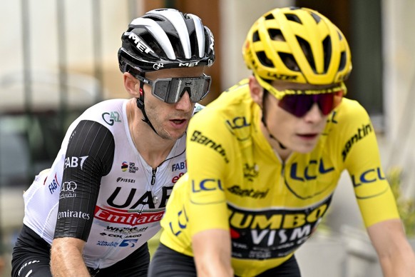 Britain's Adam Yates of Team Emirates and Denmark's Jonas Vinggaard of Jumbo-Visma are photographed during stage 17 of the Tour de France from Saint-Gervais Mont Blanc to Courchevel 165 ...