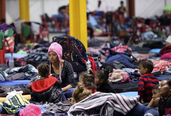 Honduran Delia Romero, 24, sits with her children in their sleeping area at a sheltered in Piedras Negras, Mexico, Tuesday, Feb. 5, 2019. A caravan of about 1,600 Central American migrants camped Tues ...