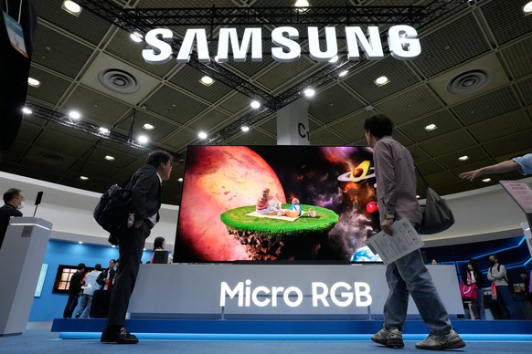 Visitors watch a Samsung Electronics' Micro RGB TV at its booth during the World IT Show in Seoul, South Korea, Wednesday, April 22, 2026. (AP Photo/Ahn Young-joon)
South Korea IT Show