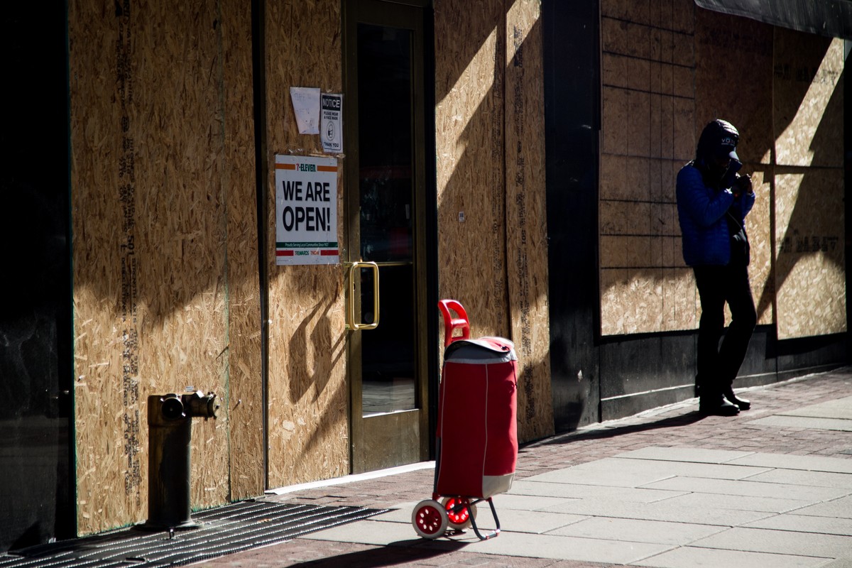 epa08797036 Plywood boards are installed in front of store windows as a precaution against potential damage from election related protests in Philadelphia, Pennsylvania, USA, 03 November 2020. America ...
