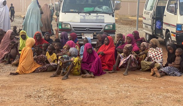Nigerian children and adults are seen after being freed from kidnappers in Zamfara state in northern Nigeria Thursday, Oct. 7, 2021. In one of the largest liberations of kidnap victims, at least 187 p ...
