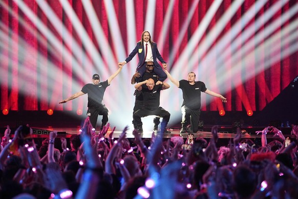 Tommy Cash from Estonia, top center, performs the song &quot;Espresso Macchiato&quot; during the Grand Final of the 69th Eurovision Song Contest, in Basel, Switzerland, Saturday, May 17, 2025. (AP Pho ...