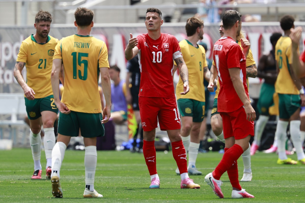Switzerland's Granit Xhaka, center, argues Australia's Kai Trewin during a friendly soccer match between Switzerland and Australia at the Snapdragon Stadium in San Diego, California, USA, Sa ...
