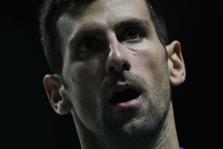 Serbia&#039;s Novak Djokovic grimaces as he plays Croatia&#039;s Marin Cilic during their Davis Cup tennis semi-final match at Madrid Arena in Madrid, Spain, Friday, Dec. 3, 2021. (AP Photo/Bernat Arm ...