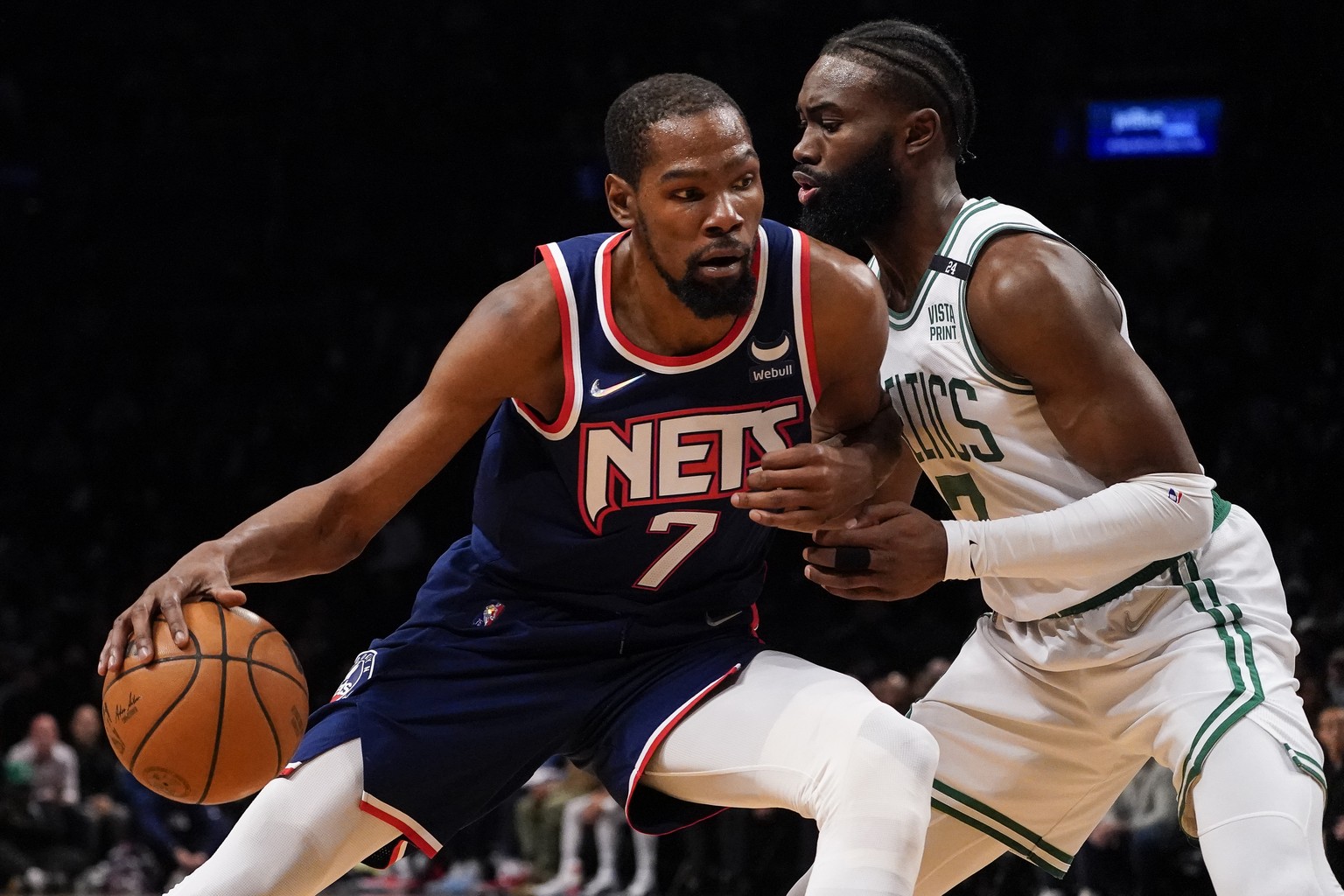 FILE - Brooklyn Nets forward Kevin Durant (7) drives against Boston Celtics guard Jaylen Brown, right, during the first half of Game 4 of an NBA basketball first-round playoff series April 25, 2022, i ...