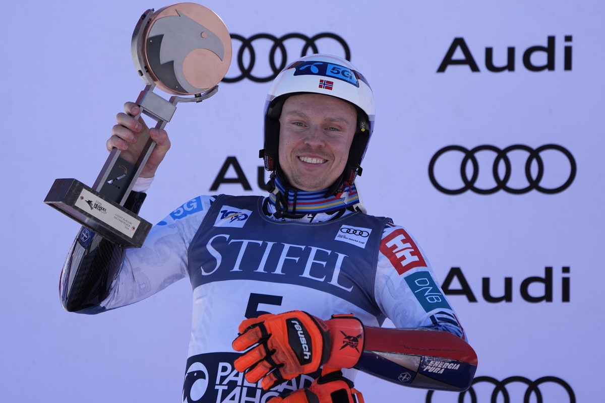 Second place finisher Norway's Henrik Kristoffersen celebrates on the podium after a men's World Cup giant slalom skiing race Saturday, Feb. 24, 2024, in Olympic Valley, Calif. (AP Photo/Joh ...