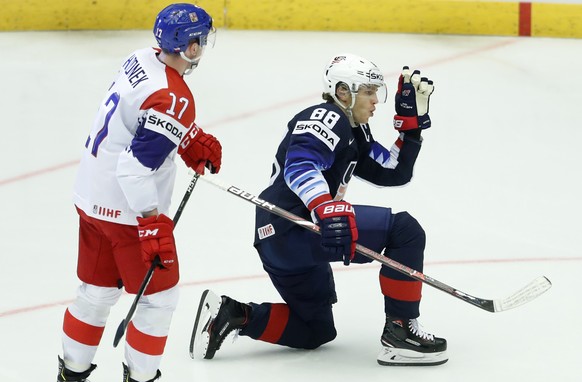 Czech Republic&#039;s Filip Hronek, left, skates past as Patrick Kane, right, of the United States celebrates after scoring his sides third goal during the Ice Hockey World Championships quarterfinal  ...