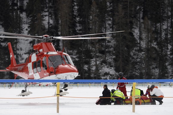 Jockey George Baker is transported to a hospital by helicopter after crashing during the GP Moyglare Stud, on the frozen Lake on the third weekend of the White Turf races in St. Moritz, Switzerland, o ...