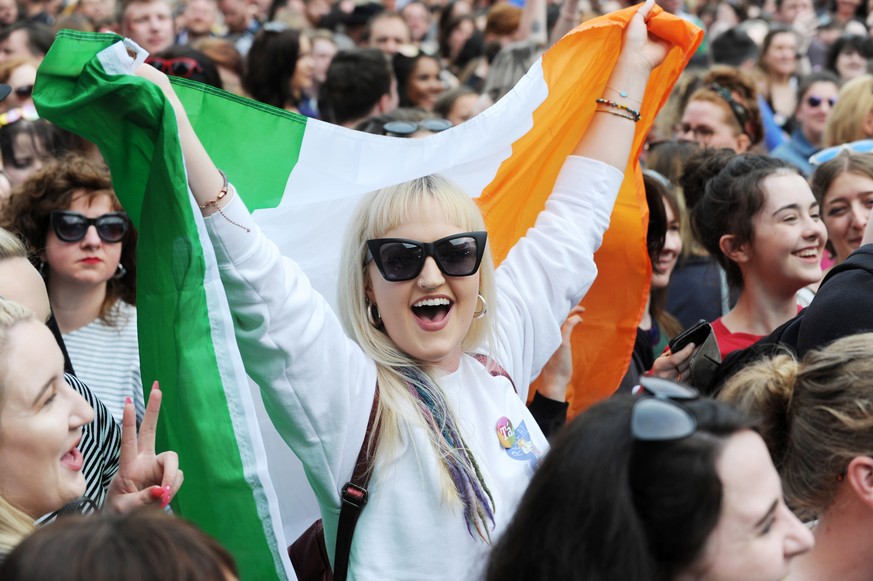 epa06765147 People celebrate as they wait for the official result of the Abortion Referendum, in Dublin, Ireland, 26 May 2018. According to exit polls, a majority in Ireland has voted to legalize abor ...