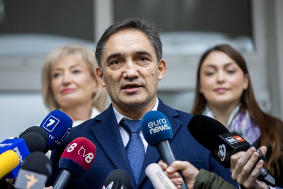 epa11670763 The former Attorney General of Moldova and presidential candidate, Alexandr Stoianoglo speaks to media in front of polling station after voting in Chisinau, Moldova, 20 October 2024. Moldo ...