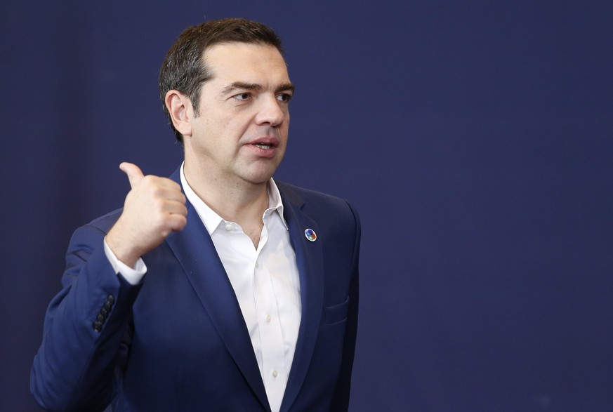 epa06347930 Greece Prime Minister Alexis Tsipras leaves the familly picture at the EU Eastern Partnership (EaP) Summit in Brussels, Belgium, 24 November 2017. The summit brings together EU heads of st ...