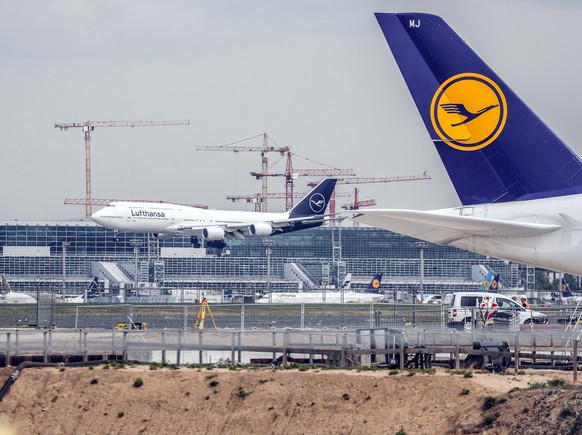 epa07730358 (FILE) - A Lufthansa passenger plane comes in to land behind the construction site of Terminal 3 of Frankfurt Airport, Frankfurt, Germany, 29 April 2019 (Reissued 20 July 2019). According  ...