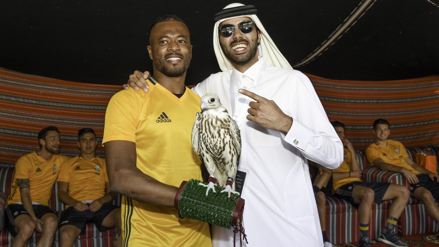 IMAGE DISTRIBUTED FOR QATAR TOURISM AUTHORITY - Patrice Evra, left, with his teammates from Italian Super Cup finalists Juventus F.C., enjoy some authentic Qatari hospitality while training for their  ...