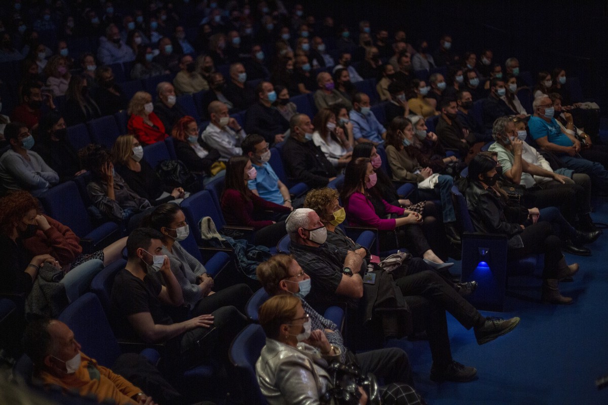 Vaccinated spectators wear face masks as they watch actors on stage at Habima, Israel's national theater, in Tel Aviv, Israel, Sunday, April 4, 2021. Israel has vaccinated over half its populatio ...