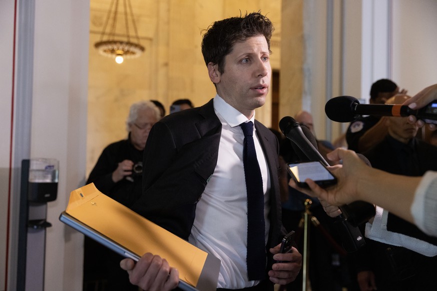 epa10858734 CEO of OpenAI Sam Altman speaks to members of the news media as he arrives to join other tech leaders attending the Senate bipartisan Artificial Intelligence (AI) Insight Forum in the Russ ...