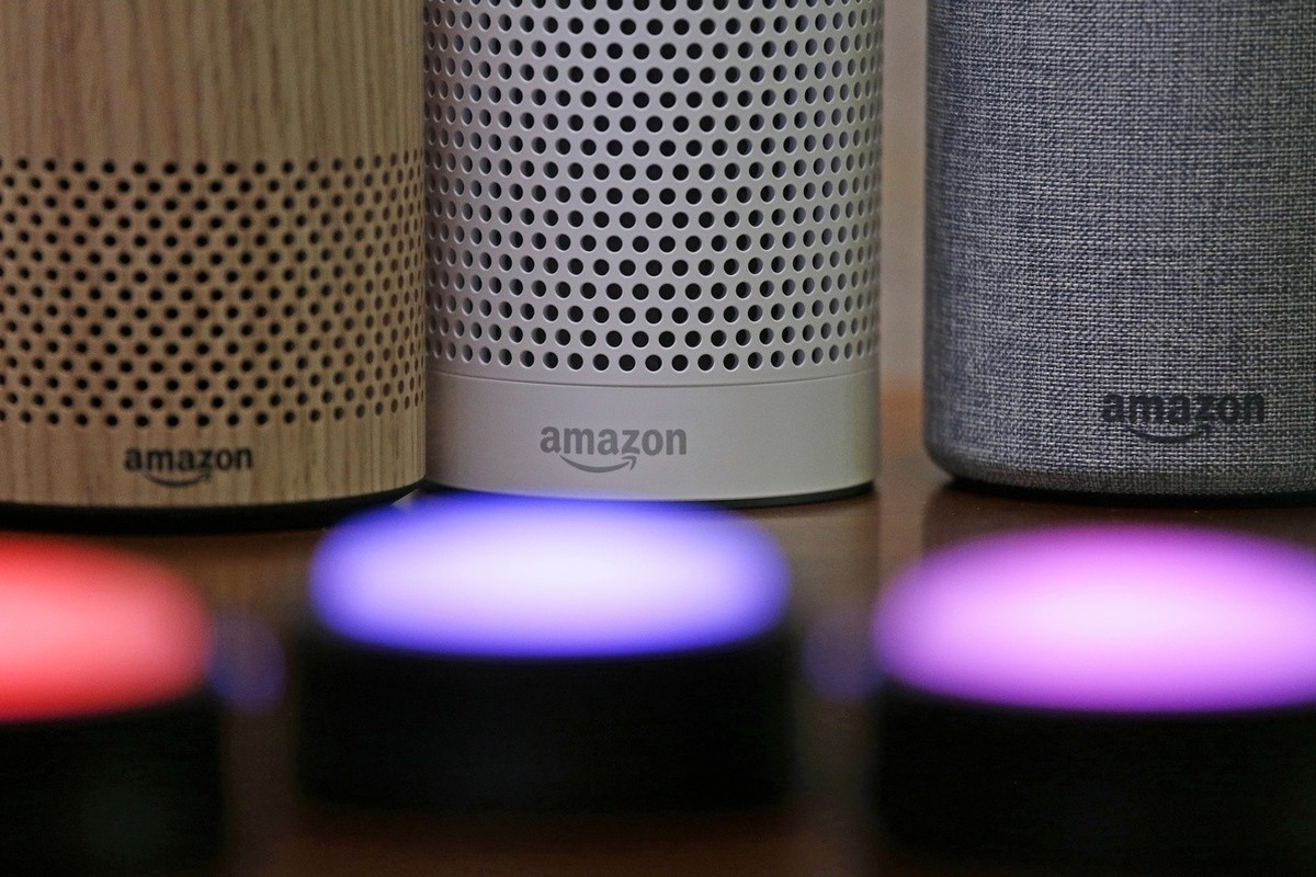 Amazon Echo and Echo Plus devices, behind, sit near illuminated Echo Button devices during an event by the company in Seattle on Sept. 27, 2017.