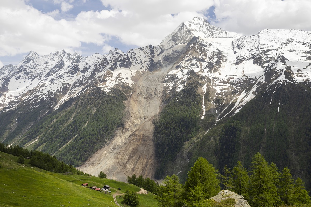 KEYPIX - A view of the Kleines Nesthorn mountain showing the trace of the rocks which broke off and slid towards the valley above the village of Blatten, Switzerland, Sunday, June 1, 2025. A large par ...