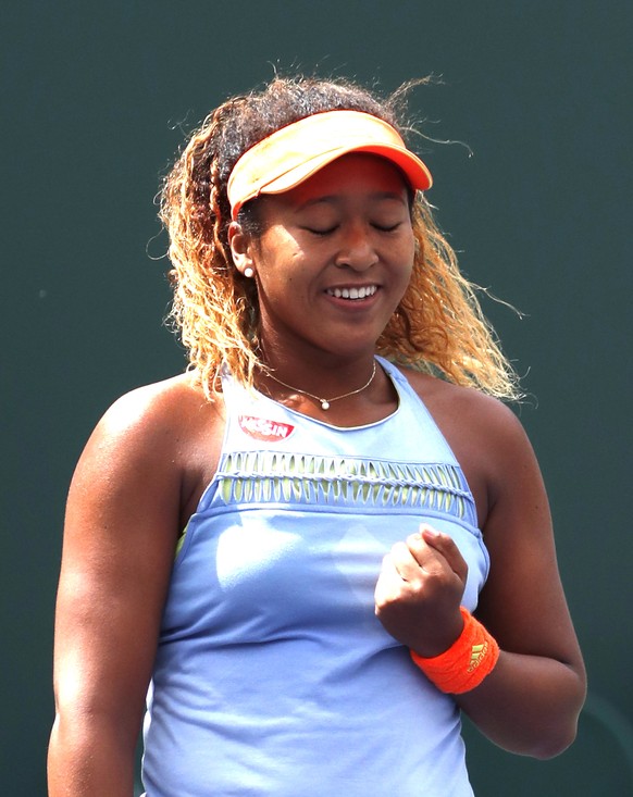 epa06613078 Naomi Osaka from Japan reacts after defeating Daria Kasatkina from Russia in their final match of the BNP Paribas Open at the Indian Wells Tennis Garden in Indian Wells, California, USA, 1 ...