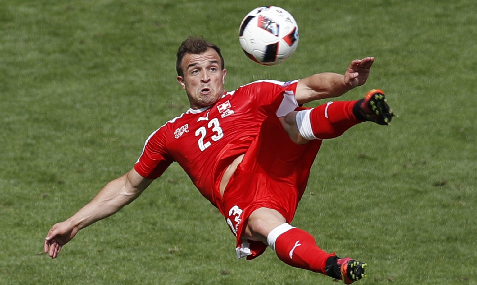 Switzerland&#039;s Xherdan Shaqiri scores on an acrobatic kick during the Euro 2016 round of 16 soccer match between Switzerland and Poland, at the Geoffroy Guichard stadium in Saint-Etienne, France,  ...