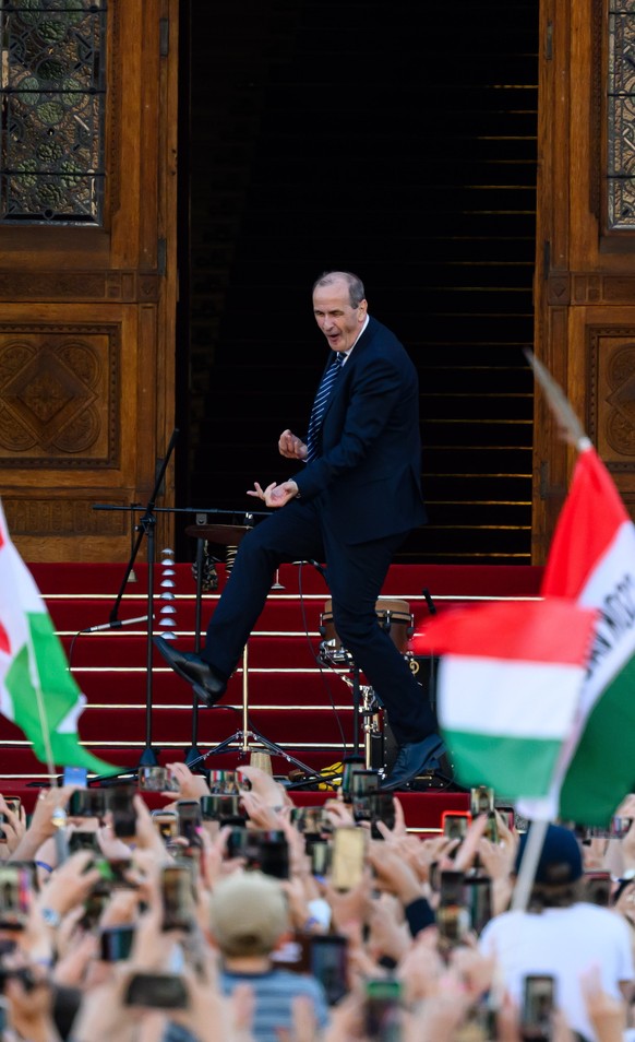 Prospective Minister of Health Zsolt Hegedus dances on the steps of the Parliament building next to newly sworn-in Prime Minister Peter Magyar, left, at Tisza Party's all-day "regime change  ...