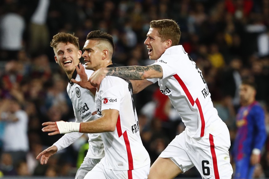 Frankfurt&#039;s Rafael Santos Borre, center, celebrates after scoring his side&#039;s second goal during the Europa League, second leg, quarterfinal soccer match between Barcelona and Eintracht Frank ...