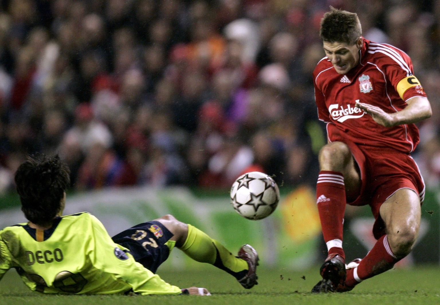 Liverpool's Steven Gerrard, right, is tackled by Barcelona's Deco during their Champion's League first knockout round, second leg soccer match, in Liverpool, England, Tuesday March 6, 2007. (AP Photo/ ...