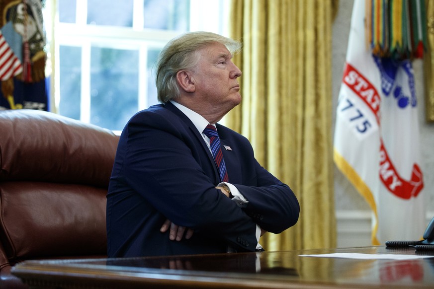 President Donald Trump pauses as he speaks in the Oval Office of the White House in Washington, Friday, July 26, 2019. Trump announced that Guatemala is signing an agreement to restrict asylum applica ...