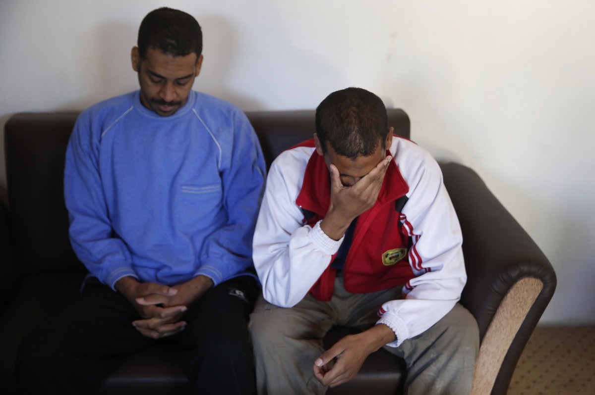 Alexanda Amon Kotey, left, and El Shafee Elsheikh, who were allegedly among four British jihadis who made up a brutal Islamic State cell dubbed "The Beatles," react during an interview with  ...