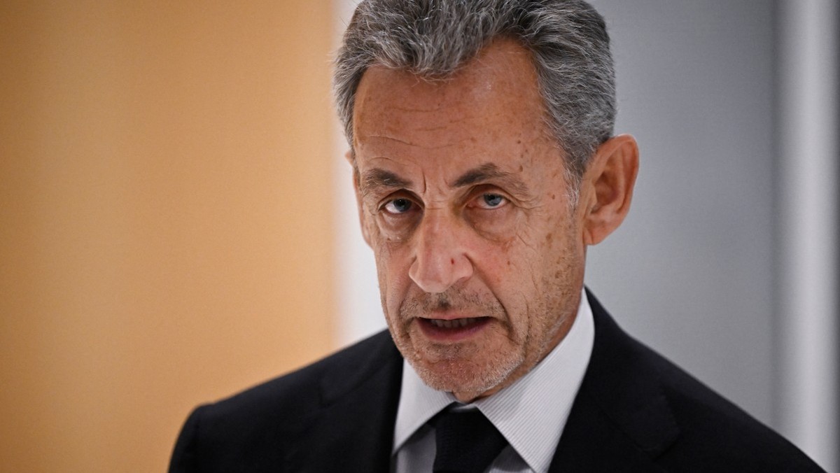 (FILES) Former French president Nicolas Sarkozy leaves after the verdict in his trial for illegal campaign financing from Libya for his successful 2007 presidential bid, at the Tribunal de Paris court ...
