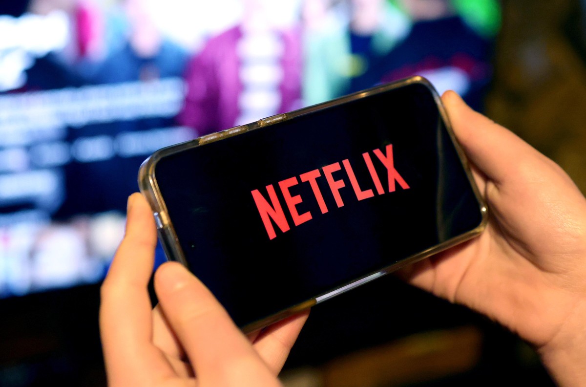epa11884079 The Netflix streaming service logo is displayed on a mobile device in London, Britain, 09 February 2025. The streaming platform has increased the cost of its most popular standard subscrip ...