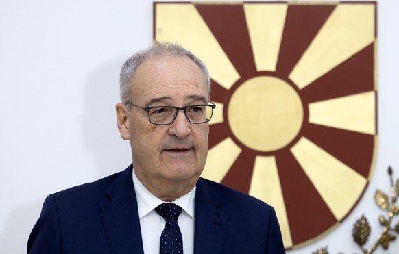 epa12921246 Swiss President Guy Parmelin reacts during the welcoming ceremony with North Macedonias President Gordana Siljanovska Davkova (not pictured) ahead of their meeting in Skopje, Republic of  ...
