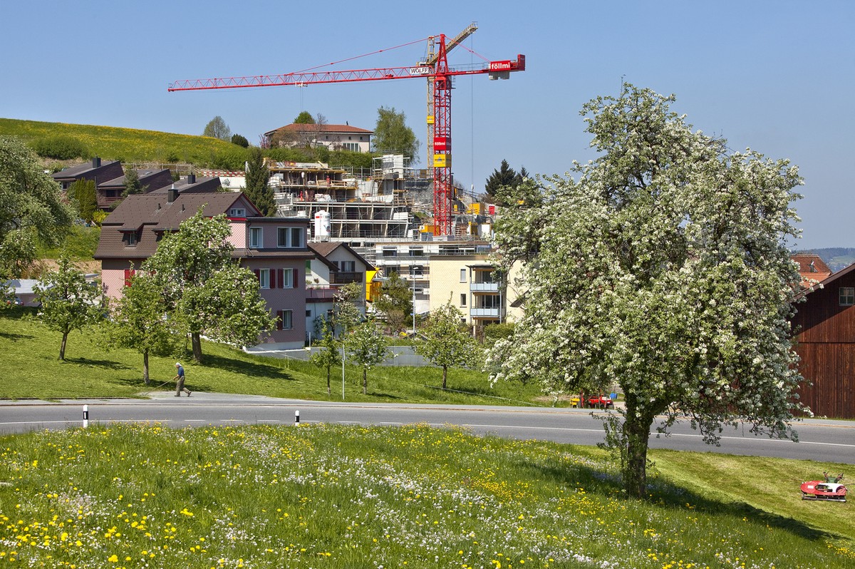 On the Felsenrain alley in Wollerau in the canton of Schwyz, Switzerland, "town with the lowest tax rates", construction for a terraced residential estate is underway, pictured on April 28,  ...