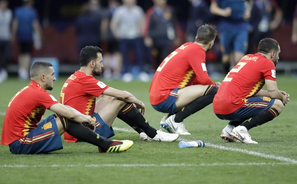 Spanish players react after there team was eliminated during the round of 16 match between Spain and Russia at the 2018 soccer World Cup at the Luzhniki Stadium in Moscow, Russia, Sunday, July 1, 2018 ...