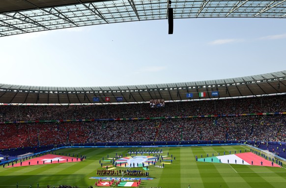 epa11445187 A general view as the teams stand for the national anthems prior to the UEFA EURO 2024 Round of 16 soccer match between Switzerland and Italy, in Berlin, Germany, 29 June 2024. EPA/MOHAMED ...