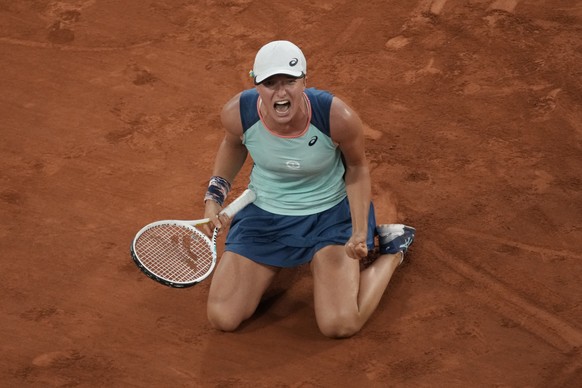 FILE - Poland&#039;s Iga Swiatek reacts as she defeats Coco Gauff during the women&#039;s final match of the French Open tennis tournament at Roland Garros stadium Saturday, June 4, 2022, in Paris. (A ...