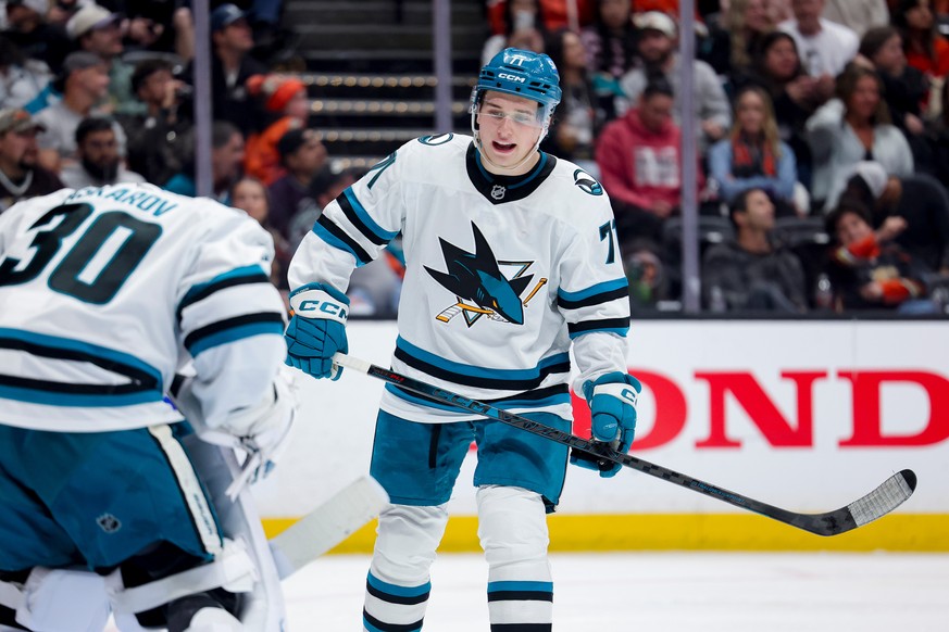 FILE - San Jose Sharks center Macklin Celebrini, right, talks with goaltender Yaroslav Askarov during the third period of an NHL hockey game against the Anaheim Ducks, April 9, 2026, in Anaheim, Calif ...