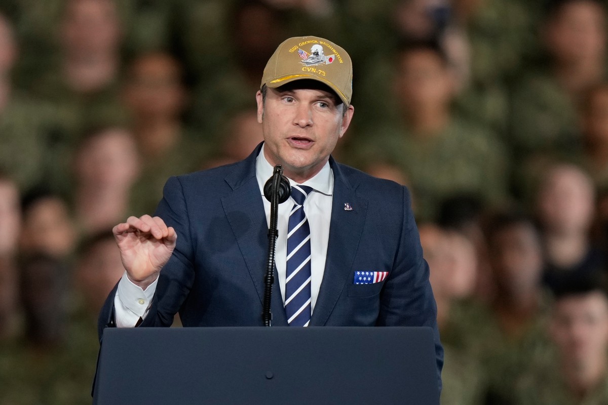 U.S. Defense Secretary Pete Hegseth speaks to soldiers and servicemen ahead of the arrival of U.S. President Donald Trump to the USS George Washington at the U.S. Navy's Yokosuka base in Yokosuka ...