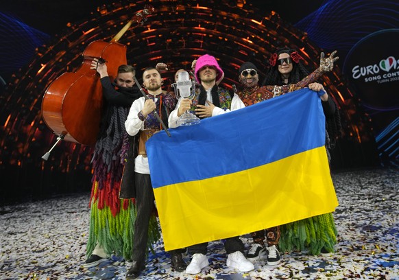 Members of the Kalush Orchestra from Ukraine celebrate after winning the Grand Final of the Eurovision Song Contest at Palaolimpico arena, in Turin, Italy, Saturday, May 14, 2022. (AP Photo/Luca Bruno ...