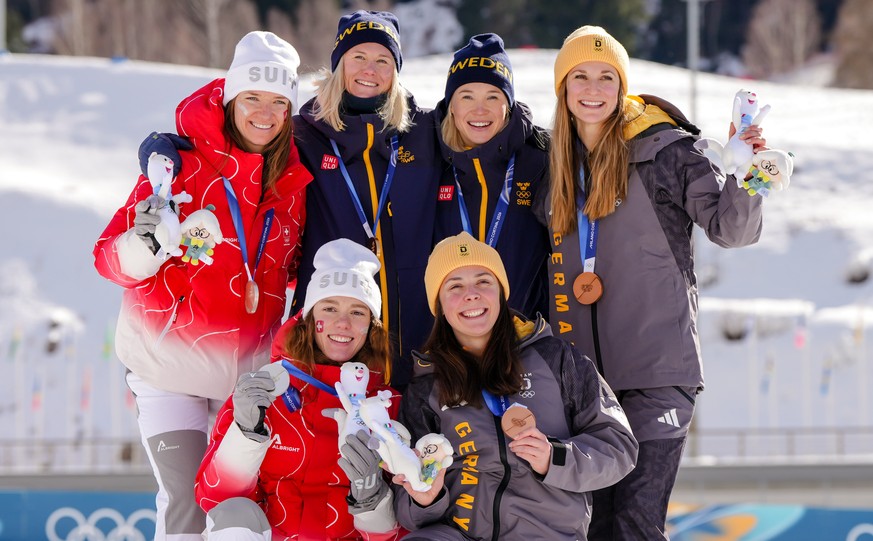 Silver medalists Nadja Kaelin and Nadine Faehndrich, of Switzerland, gold medalists Jonna Sundling and Maja Dahlqvist, of Sweden, and bronze medalists Laura Gimmler and Coletta Rydzek, of Germany, pos ...