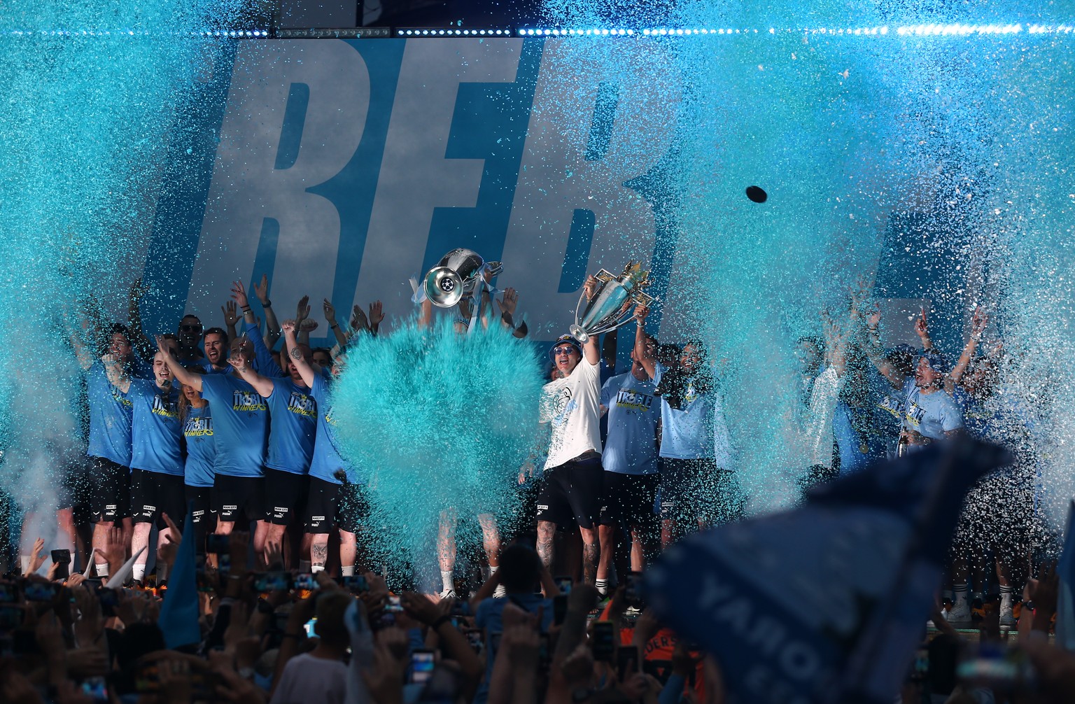 epa10687504 Manchester City players during a trophy parade in Manchester, Britain, 12 June 2023. Manchester City completed historic trophy treble by winning the UEFA Champions League, The FA Cup and t ...