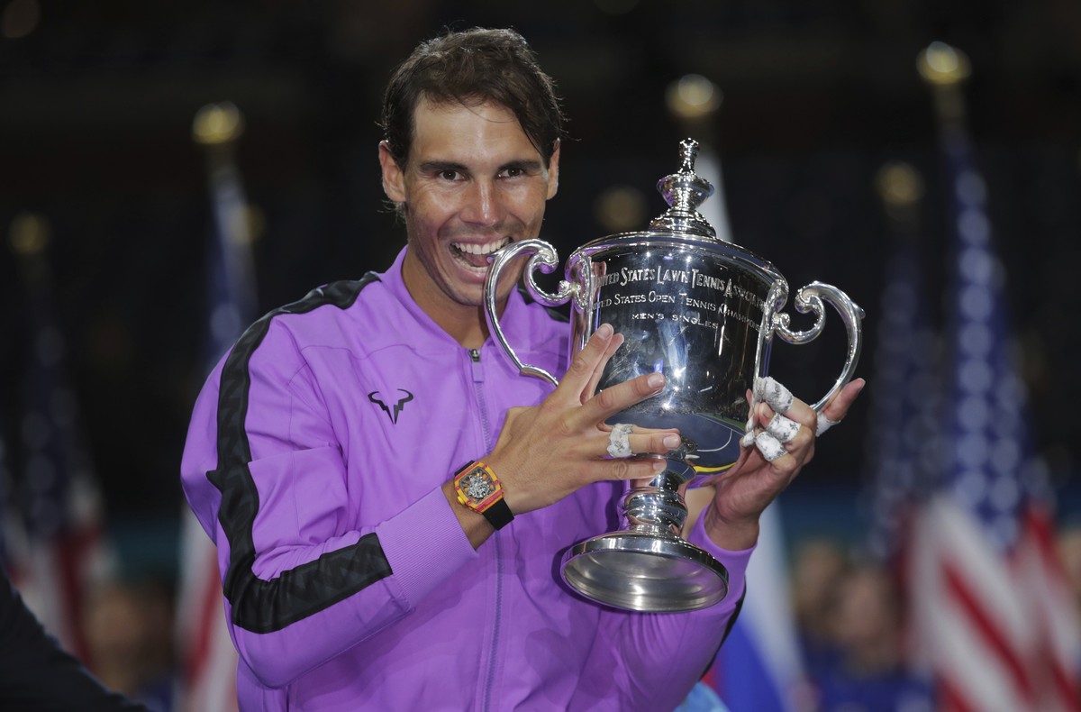 Rafael Nadal, of Spain, poses with the championship trophy after defeating Daniil Medvedev, of Russia, to win the men's singles final of the U.S. Open tennis championships Sunday, Sept. 8, 2019,  ...