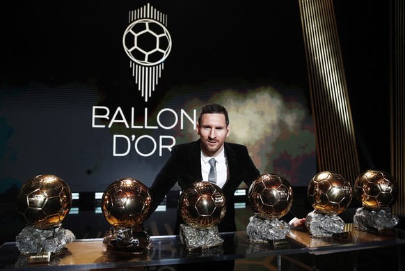 epa08040267 The Men's 2019 Ballon d'Or winner Barcelona forward Lionel Messi poses with his six Ballon d'Or trophies he won in his career so far during the ceremony at Theatre du Chatel ...