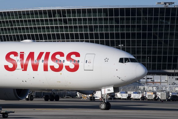 An aircraft Boeing 777 of Swiss International Air Lines in the front of &quot;the Circle&quot; at the Zurich Aeroport, in Zurich, Switzerland, Monday, April 27, 2020. (KEYSTONE/Ennio Leanza)