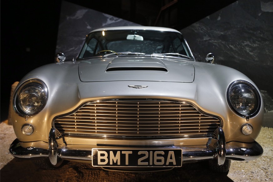 An Aston Martin DB5 from the James Bond film &quot;Goldfinger&quot; is displayed during a press presentation of the exhibition &quot;The Designing 007: Fifty Years of Bond Style&quot; at the Grande Ha ...