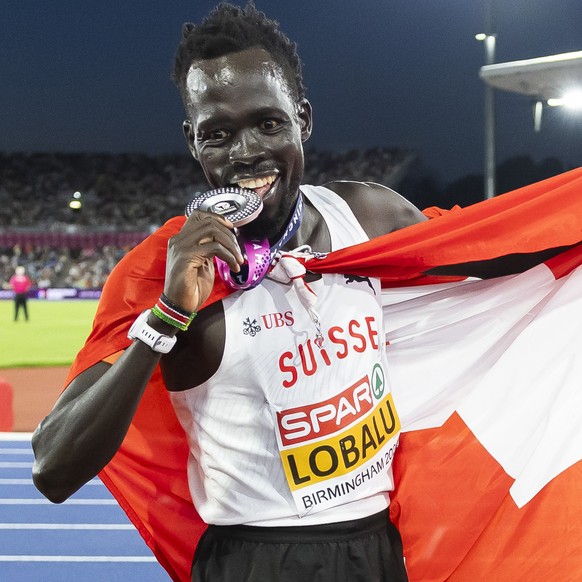 Silver medalist Dominic Lobalu of Switzerland reacts during the men's 10000 meters final at the European Athletics Championships, in the Alexander Stadium, Birmingham, United Kingdom, Saturday, A ...