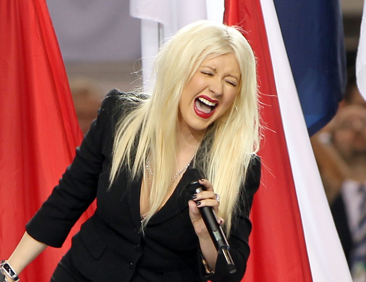 ARLINGTON, TX - FEBRUARY 06: Singer Christina Aguilera performs during the Bridgestone Super Bowl XLV Pregame Show at Dallas Cowboys Stadium on February 6, 2011 in Arlington, Texas. (Photo by Christop ...